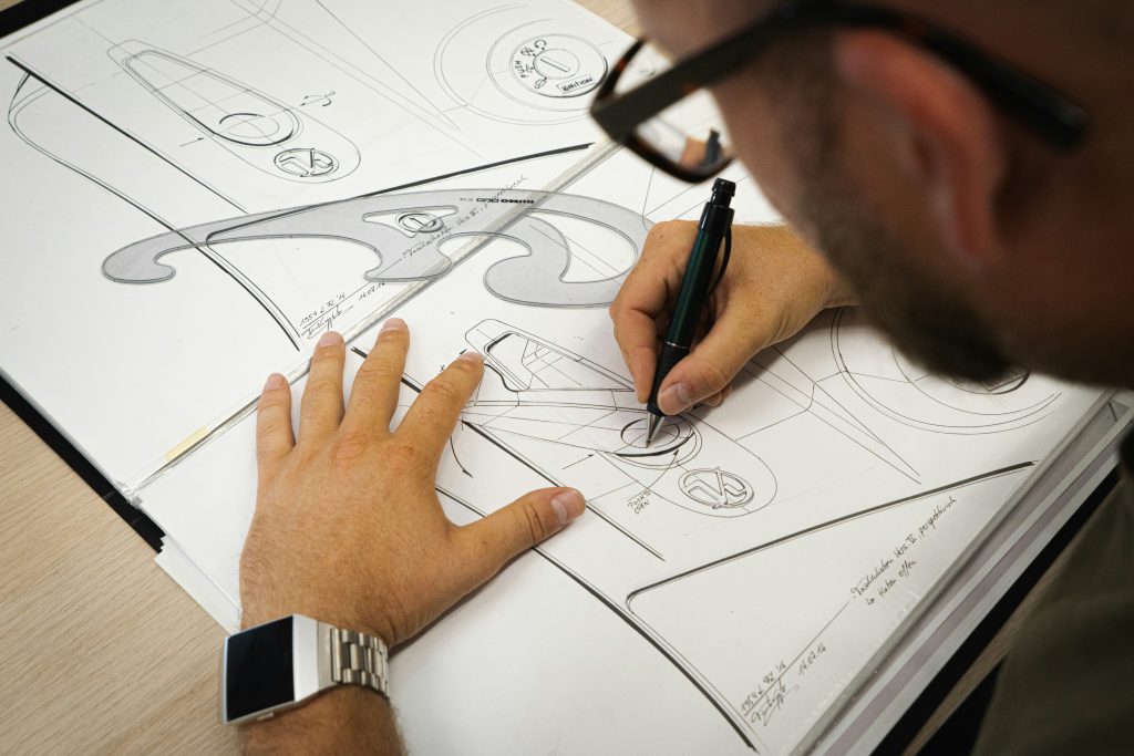 CAD drafting workstation with architectural drawing sheets